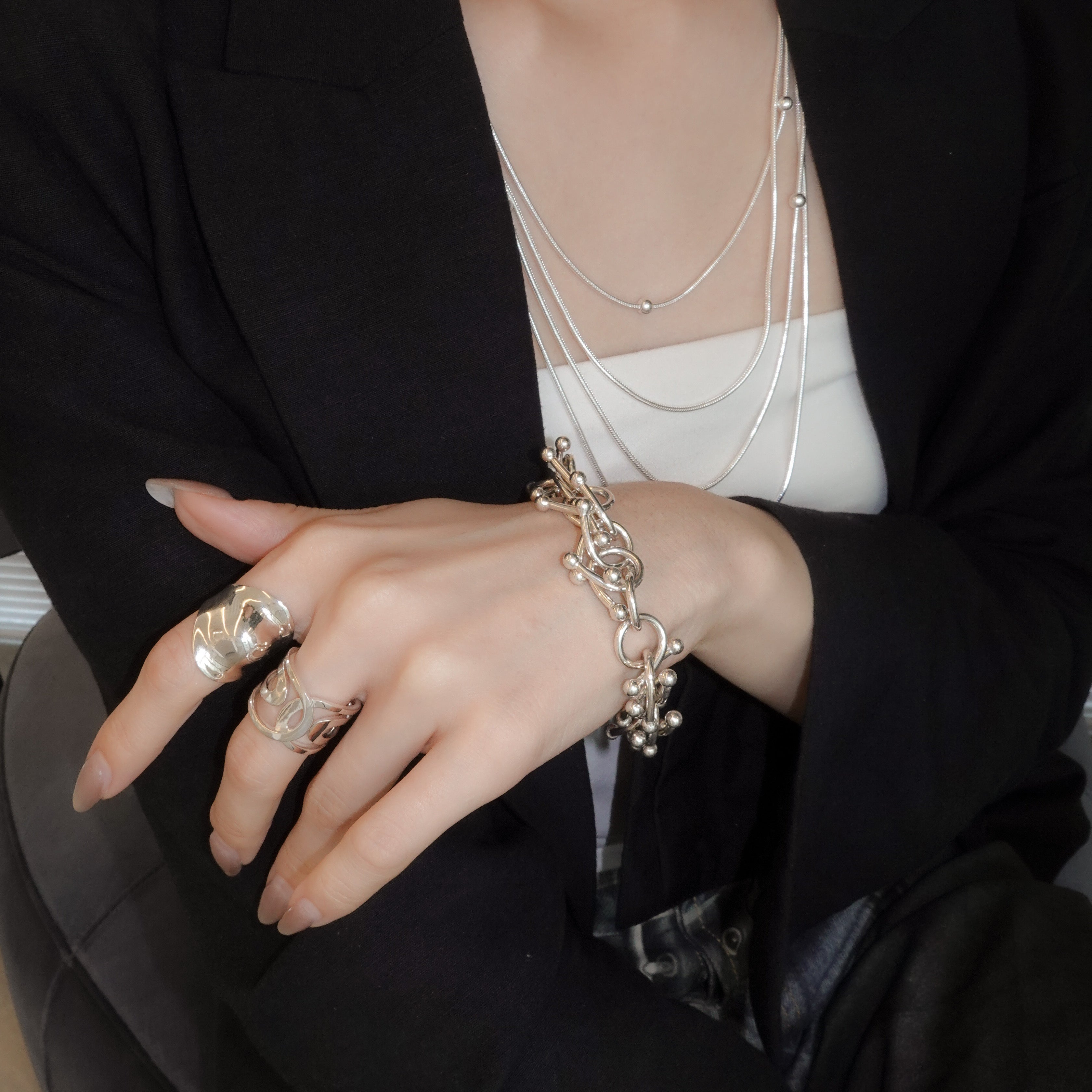 genome motif bracelet with simple parts intricately intertwined
