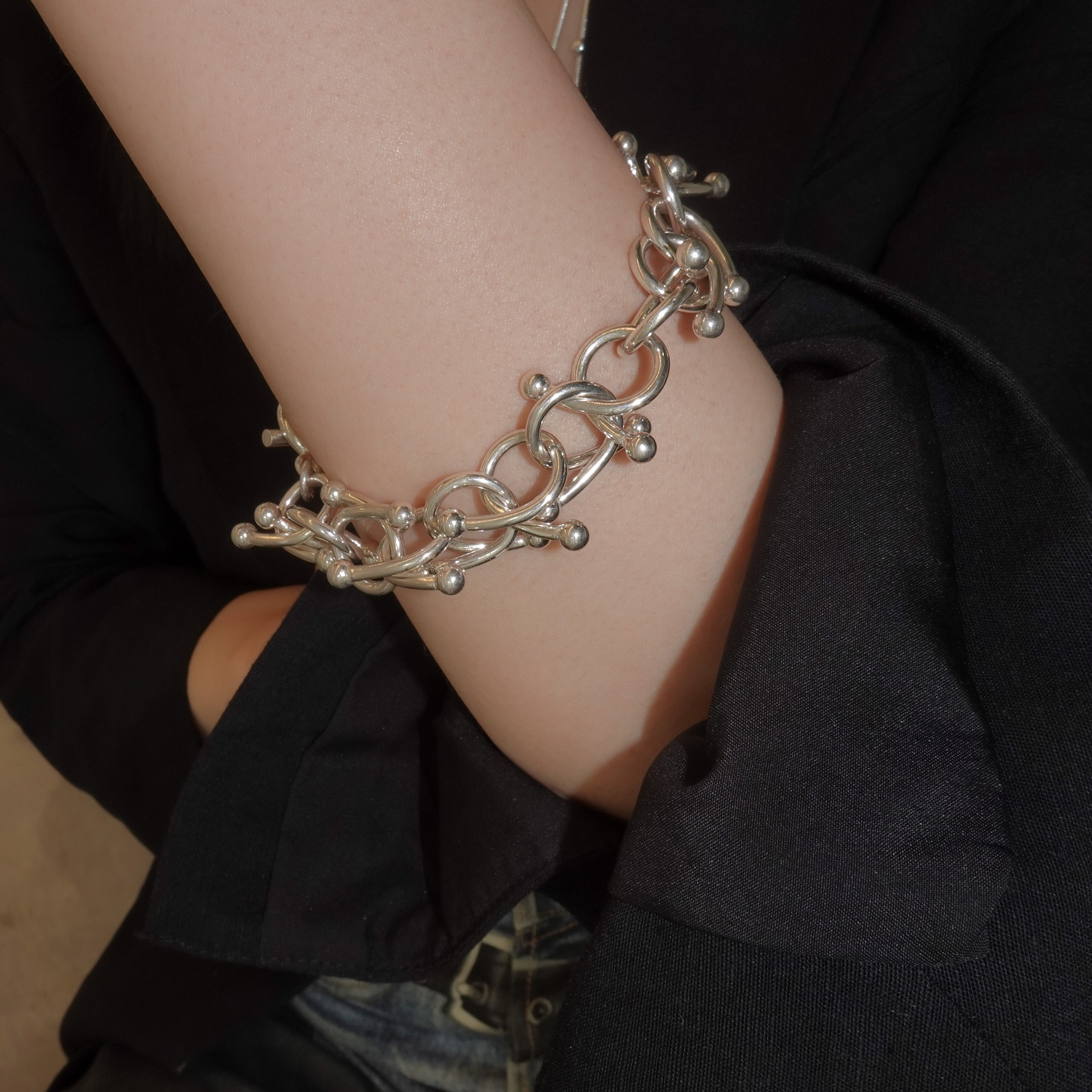 genome motif bracelet with simple parts intricately intertwined