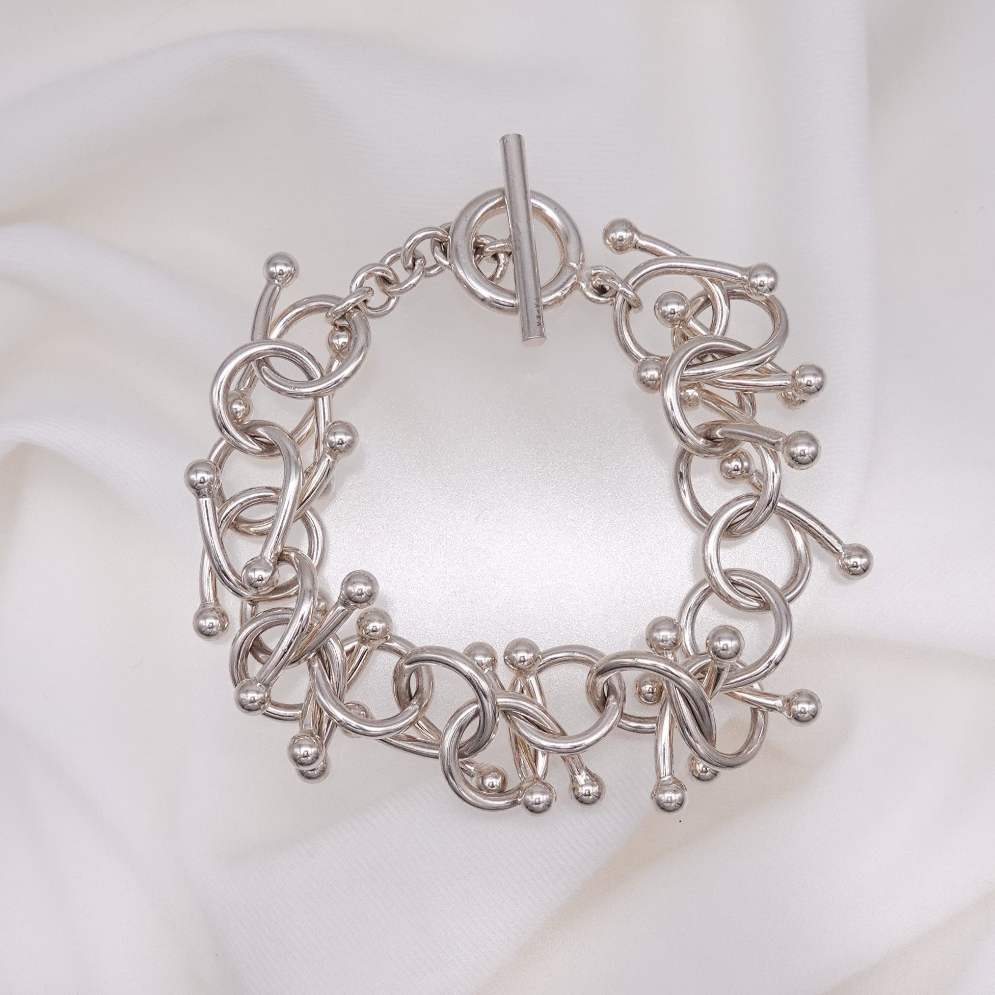 genome motif bracelet with simple parts intricately intertwined