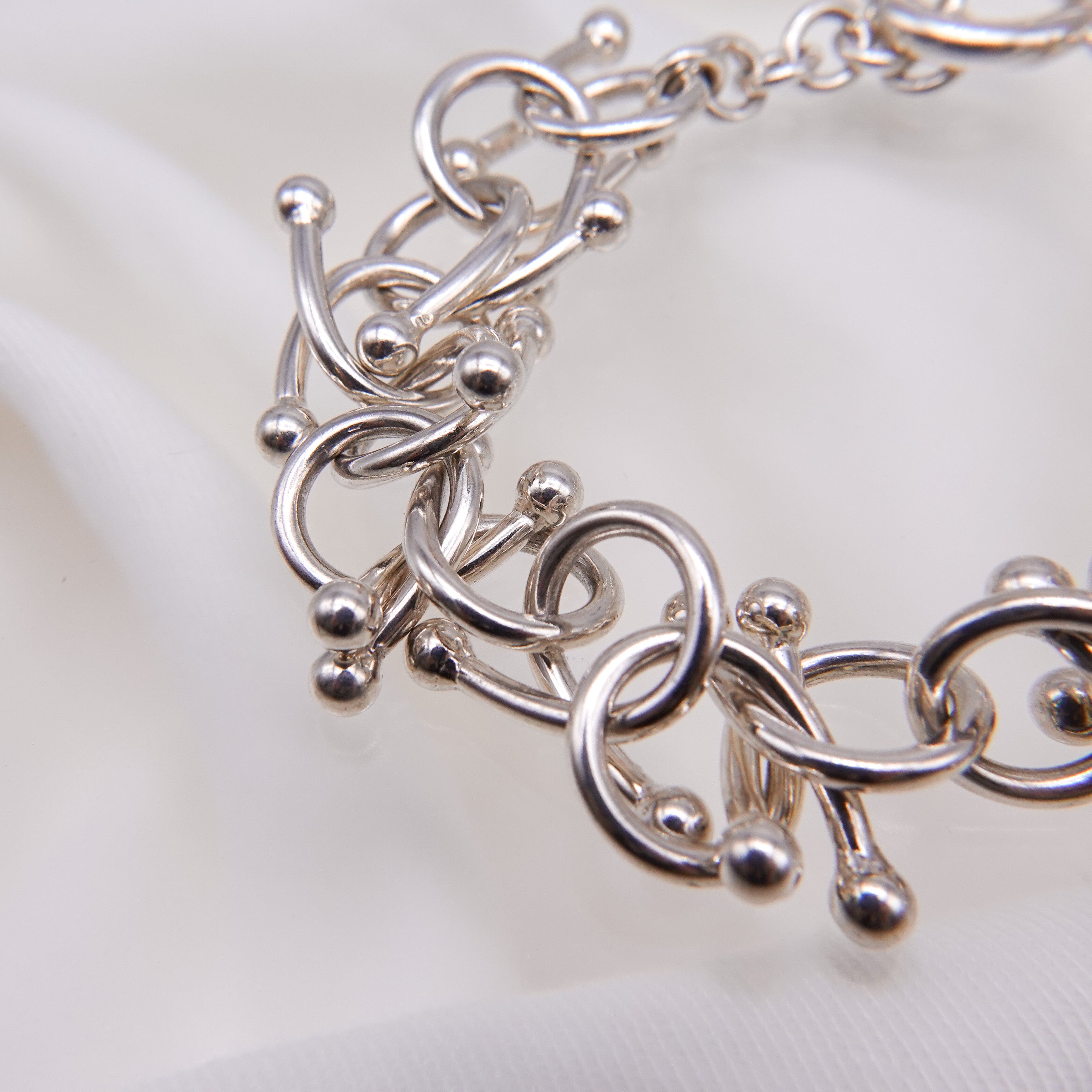 genome motif bracelet with simple parts intricately intertwined