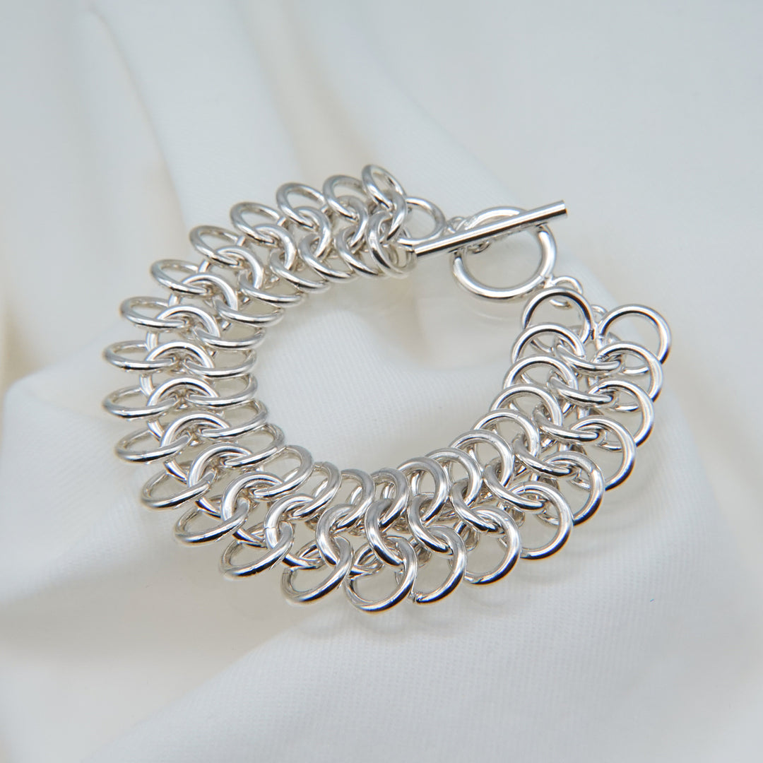 Stacked silver ring design bracelet